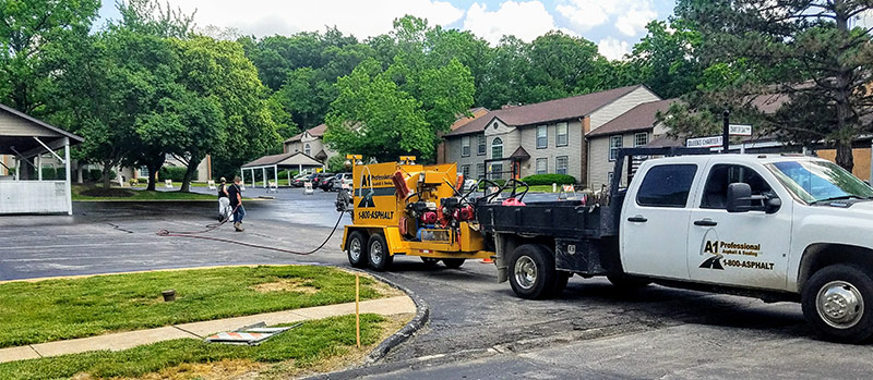 doing an asphalt sealing service at a home in St Louis, MO